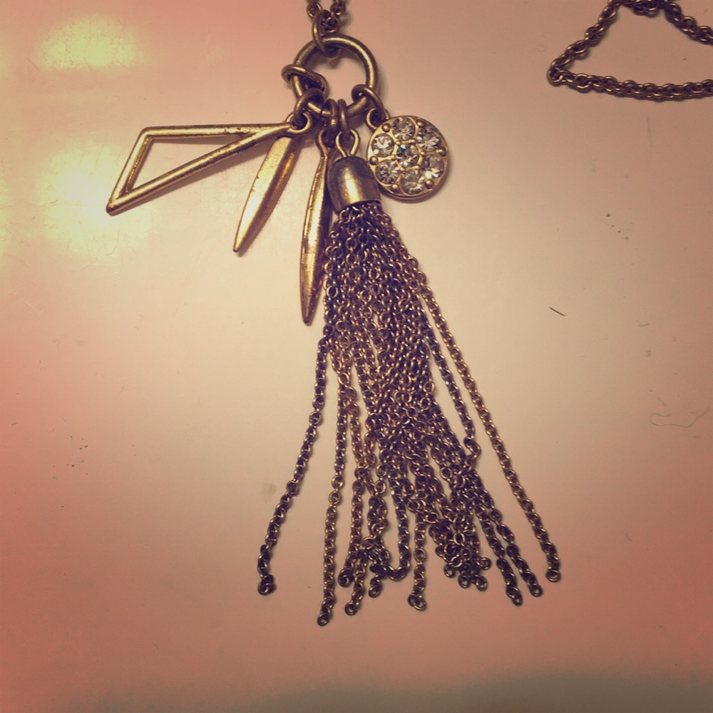 Long charmed gold necklace